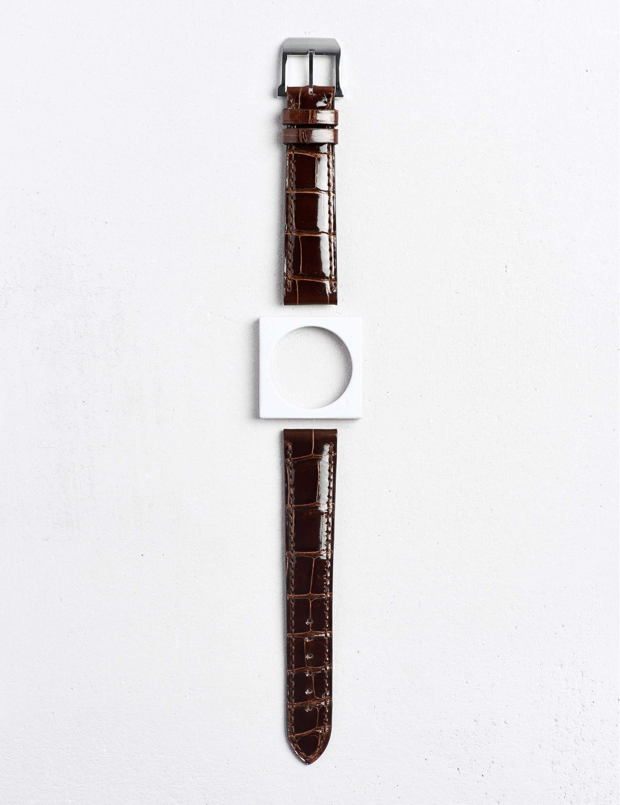 High-end leather watchstrap in shiny alligator